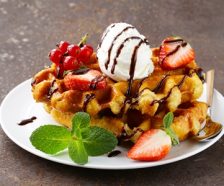 Belgian waffles with berries and ice cream